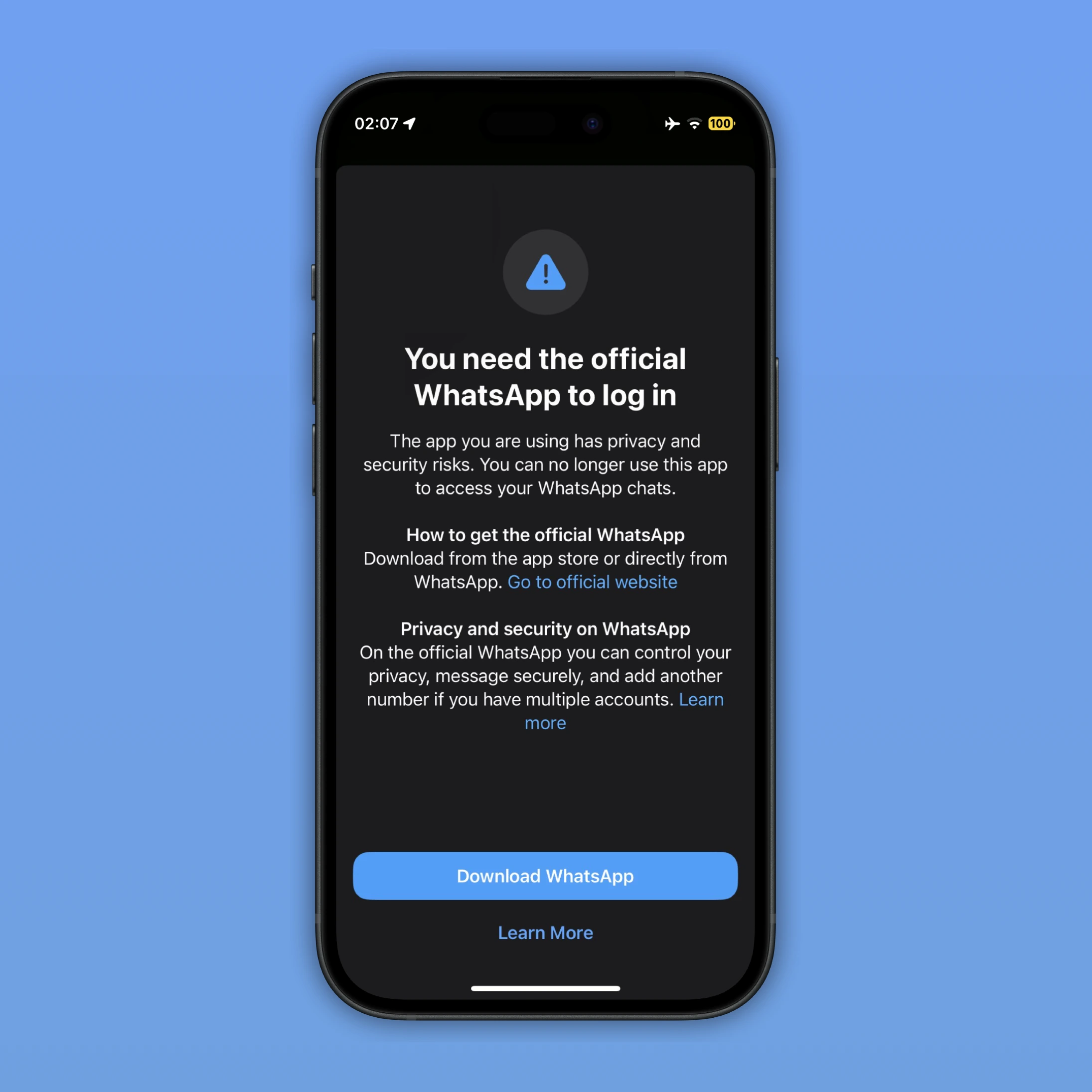 The image shows an alert that advises users to download the official WhatsApp app from the App Store