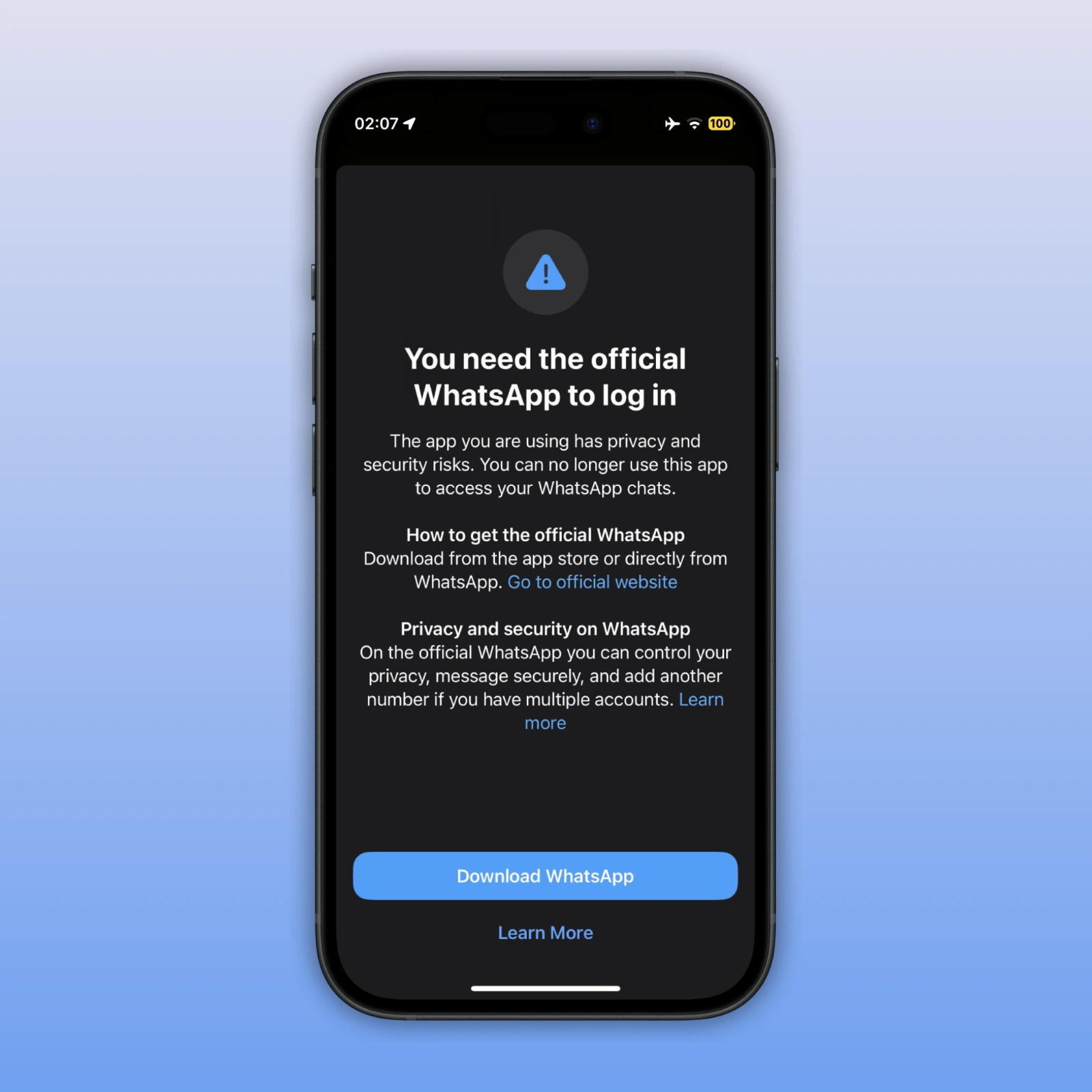 The image shows an alert that advises users to download the official WhatsApp app from the App Store